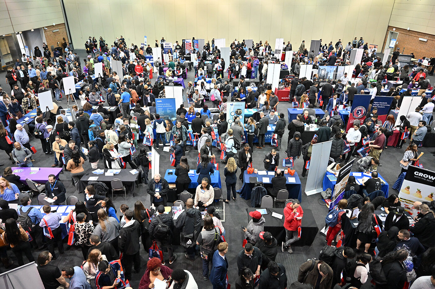 Crowded Airport Small Business Summit and Job Fair event floor